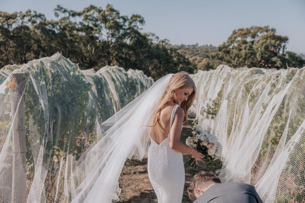 Real bride Casey wore the Wild Hearts Adina wedding dress by Karen Willis Holmes.