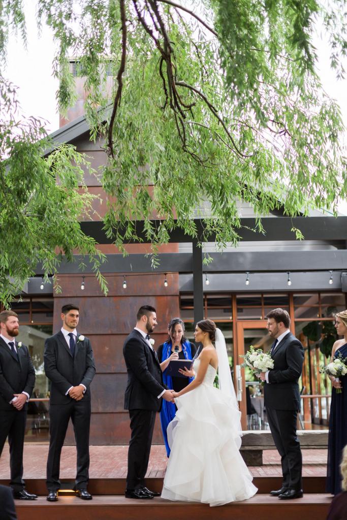 Real bride Murphy wore the Bespoke Selena wedding dress by Karen Willis Holmes.