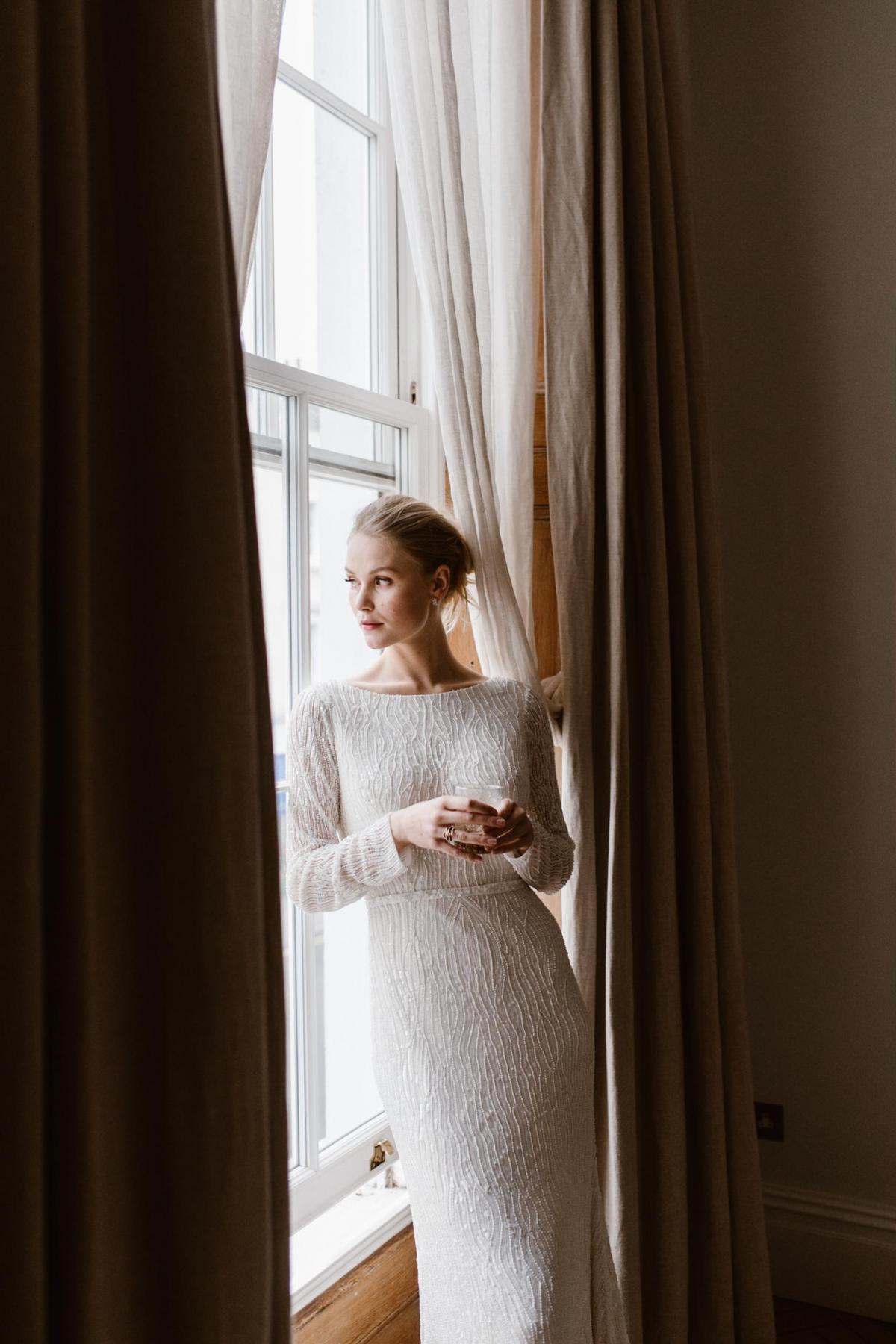 The Margareta gown by Karen Willis Holmes, beaded long sleeve wedding dress.