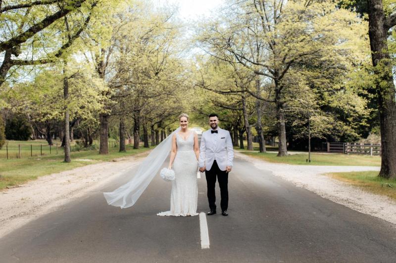 Real bride Nicole wore the Luxe Lola wedding dress by Karen Willis Holmes.