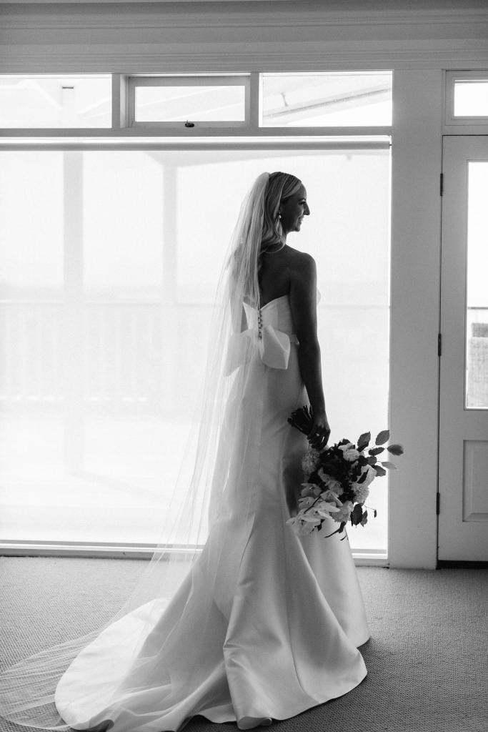 Real bride Sarah wore the Bespoke Blake/Alexia wedding dress by Karen Willis Holmes.