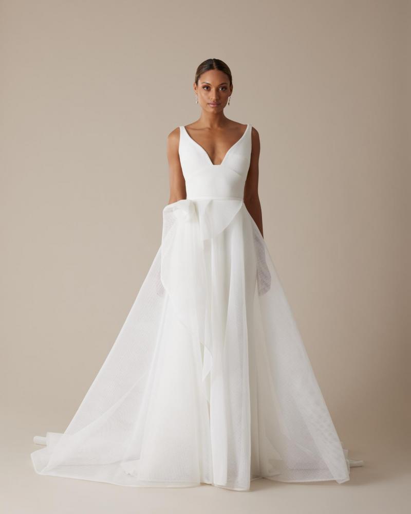 Aisha by Karen Willis Holmes- an A line wedding dress draped in honeycomb mesh