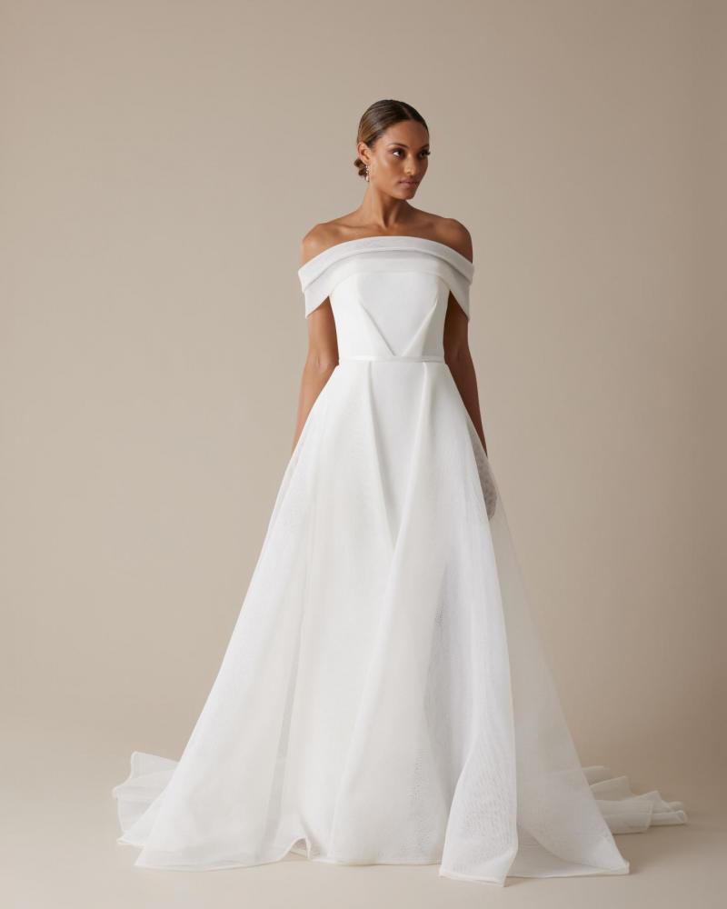 The Esther gown by Karen Willis Holmes, off the shoulder wedding dress with slit.