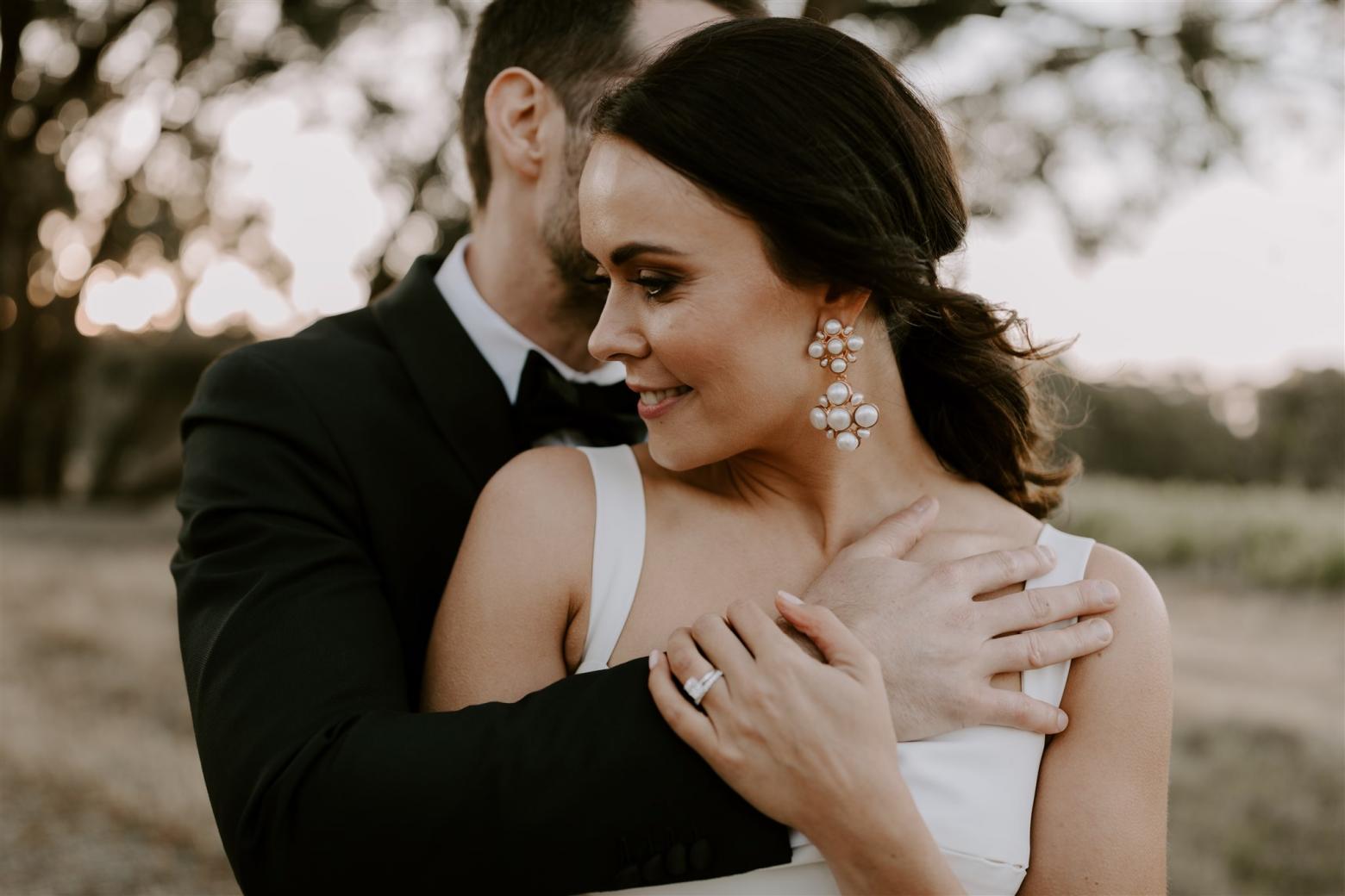 KWH bride Rachael and husband Adam sharing a moment. Rachael wears the Violet gown.