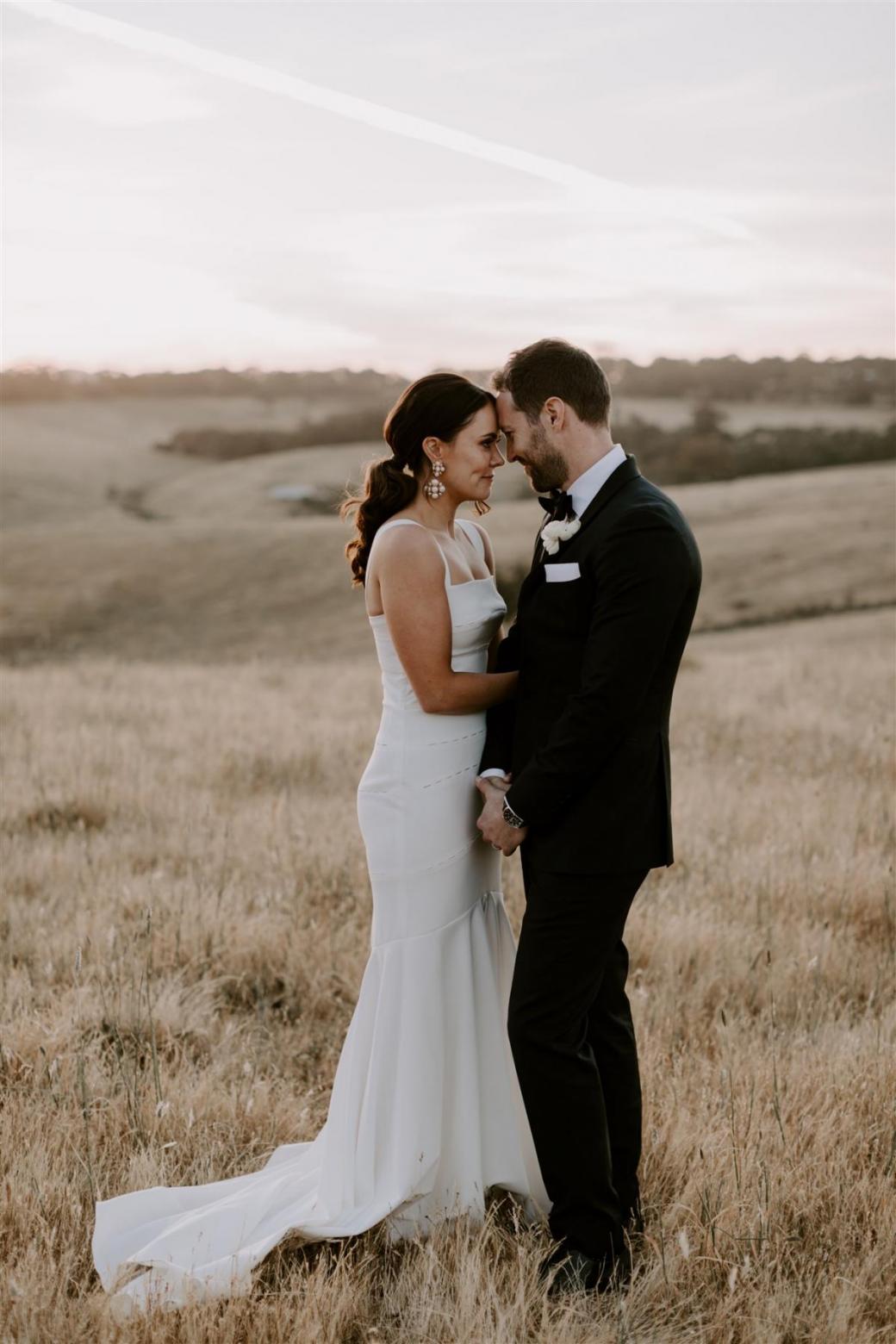 KWH bride Rachael and husband Adam sharing a moment. Rachael wears the Violet gown.