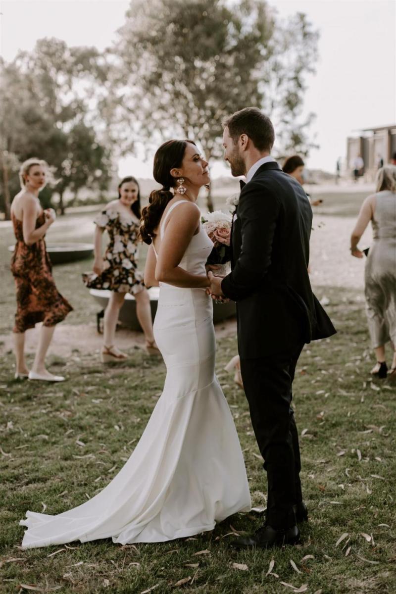 KWH bride Rachael and husband Adam sharing a moment. Rachael wears the Violet gown.