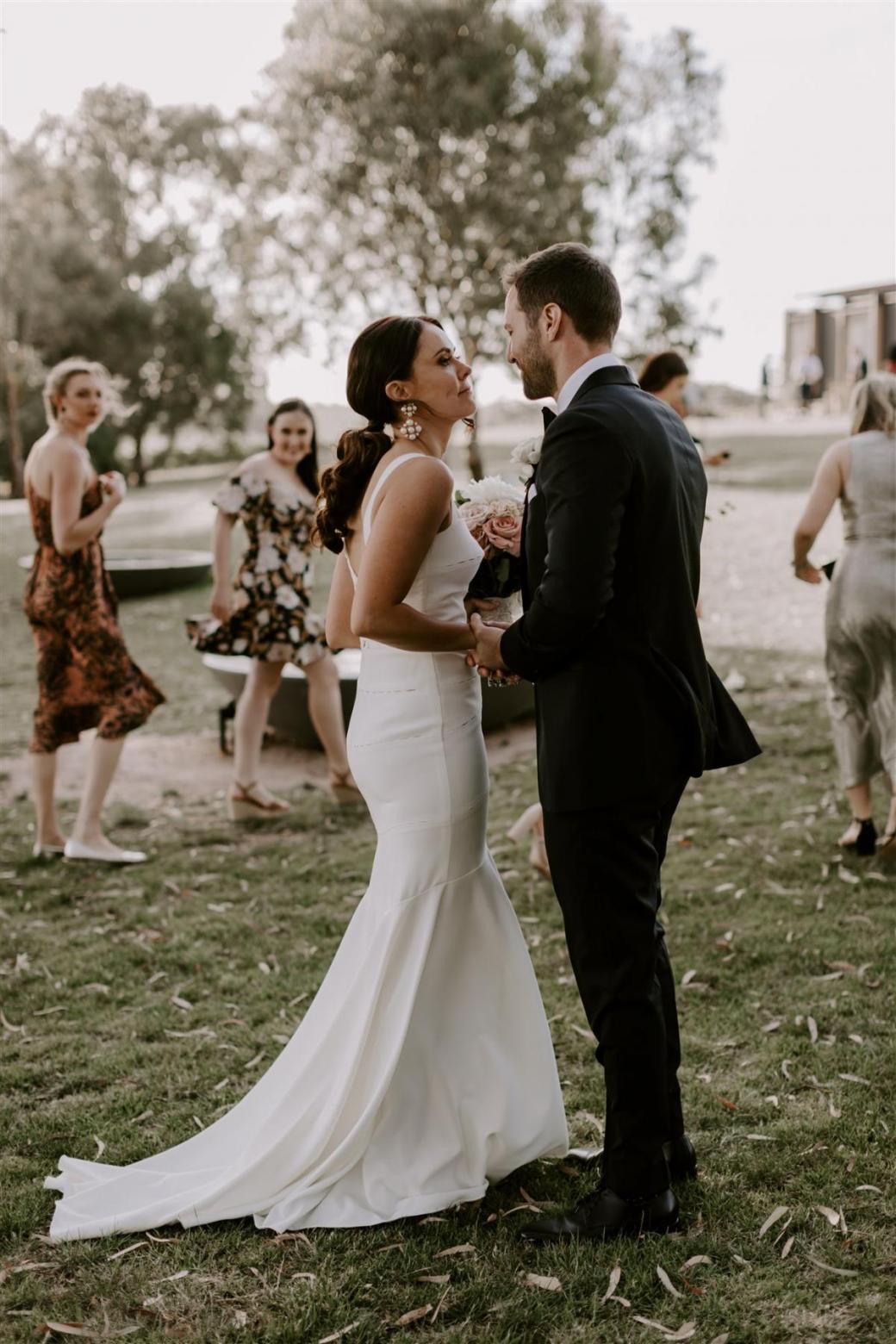 KWH bride Rachael and husband Adam after their ceremony. Rachael wears the violet gown.