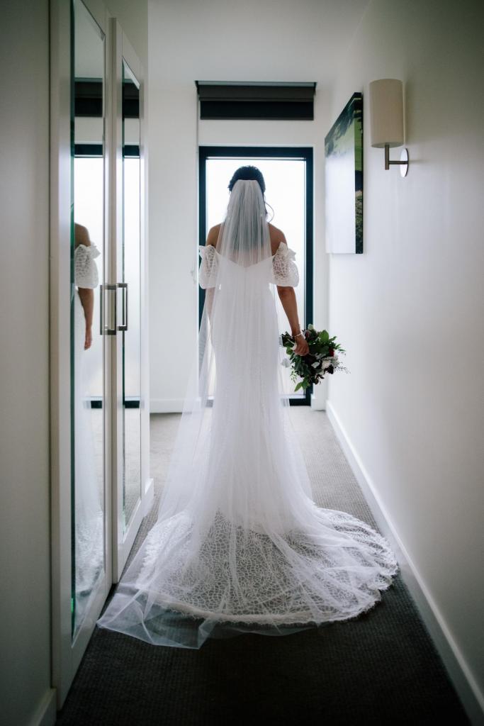 Real bride Emma wore the Wild Hearts Vivienne wedding dress by Karen Willis Holmes.