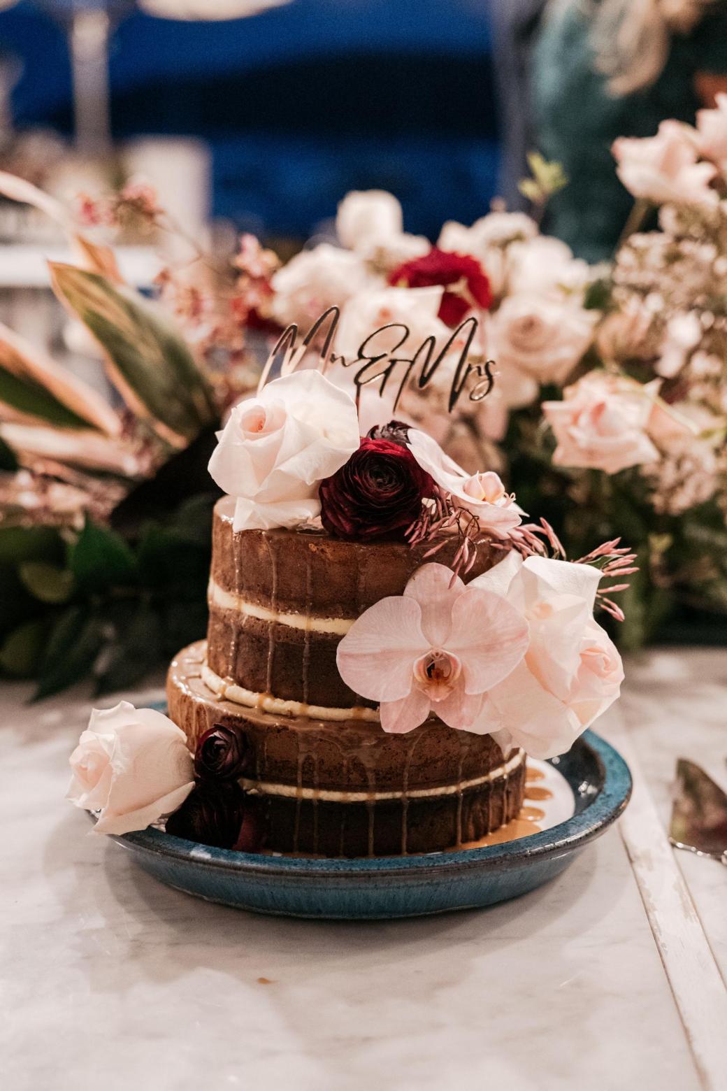KWH bride Jordana's wedding cake, featuring pink florals.