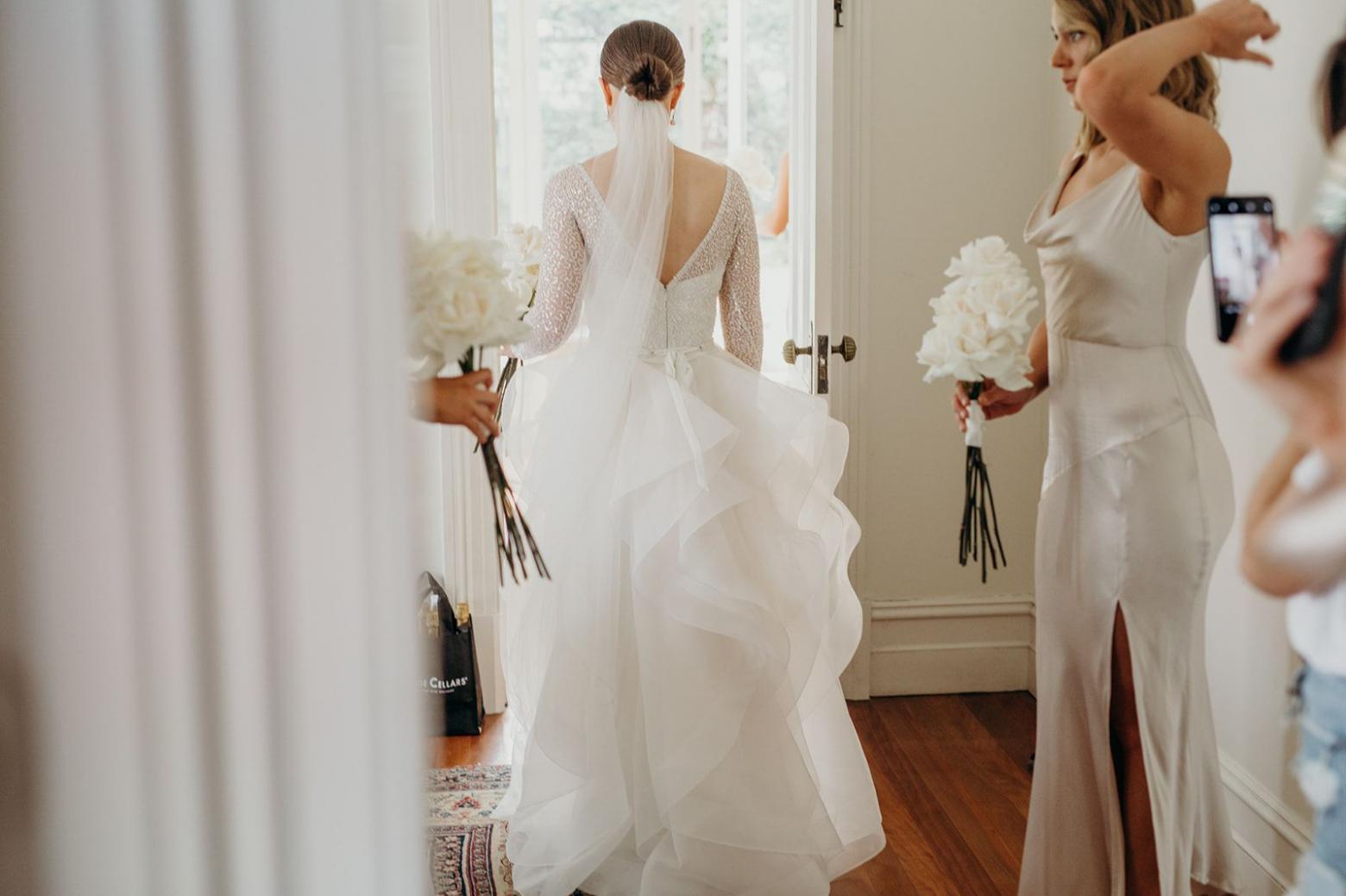 Real bride Cara wore the Luxe Celine wedding dress by Karen Willis Holmes.