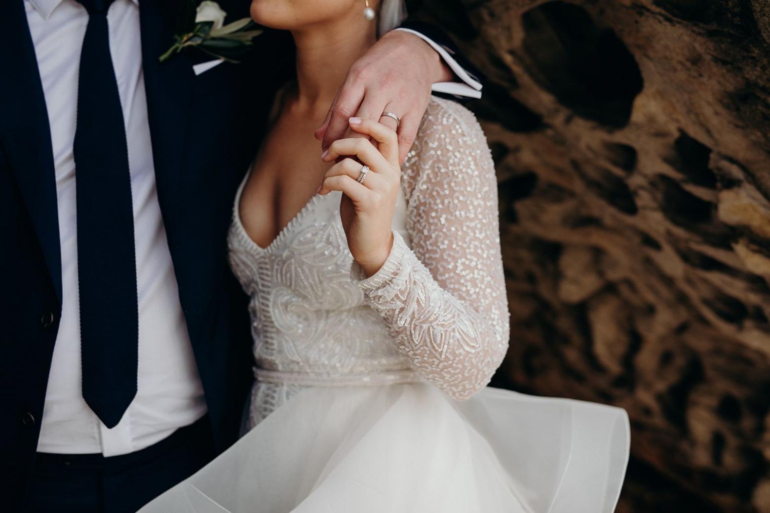 Real bride Cara wore the Luxe Celine wedding dress by Karen Willis Holmes.