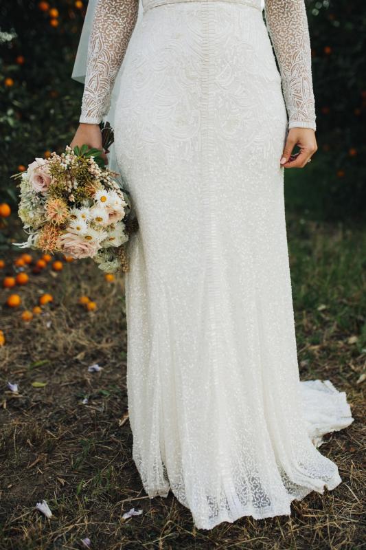 Real bride Kate wore the Luxe Celine wedding dress by Karen Willis Holmes.