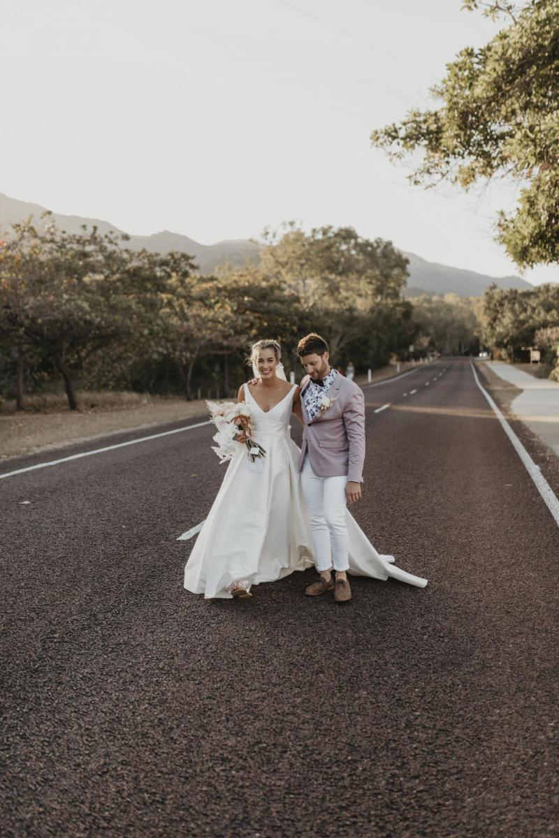 Kelsi wears the Leonie Melanie gown; a V-neck, A-line, simple wedding dress, for her Queensland wedding