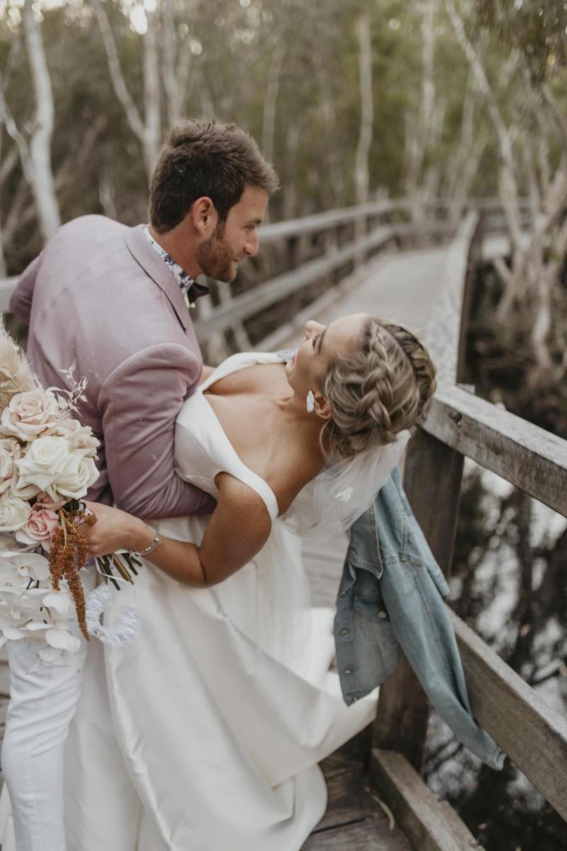 Kelsi wears the Leonie Melanie gown; a V-neck, A-line, simple wedding dress, for her Queensland wedding