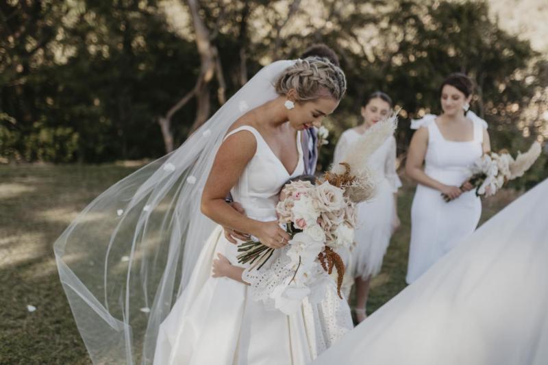 Kelsi wears the Leonie Melanie gown; a V-neck, A-line, simple wedding dress, for her Queensland wedding