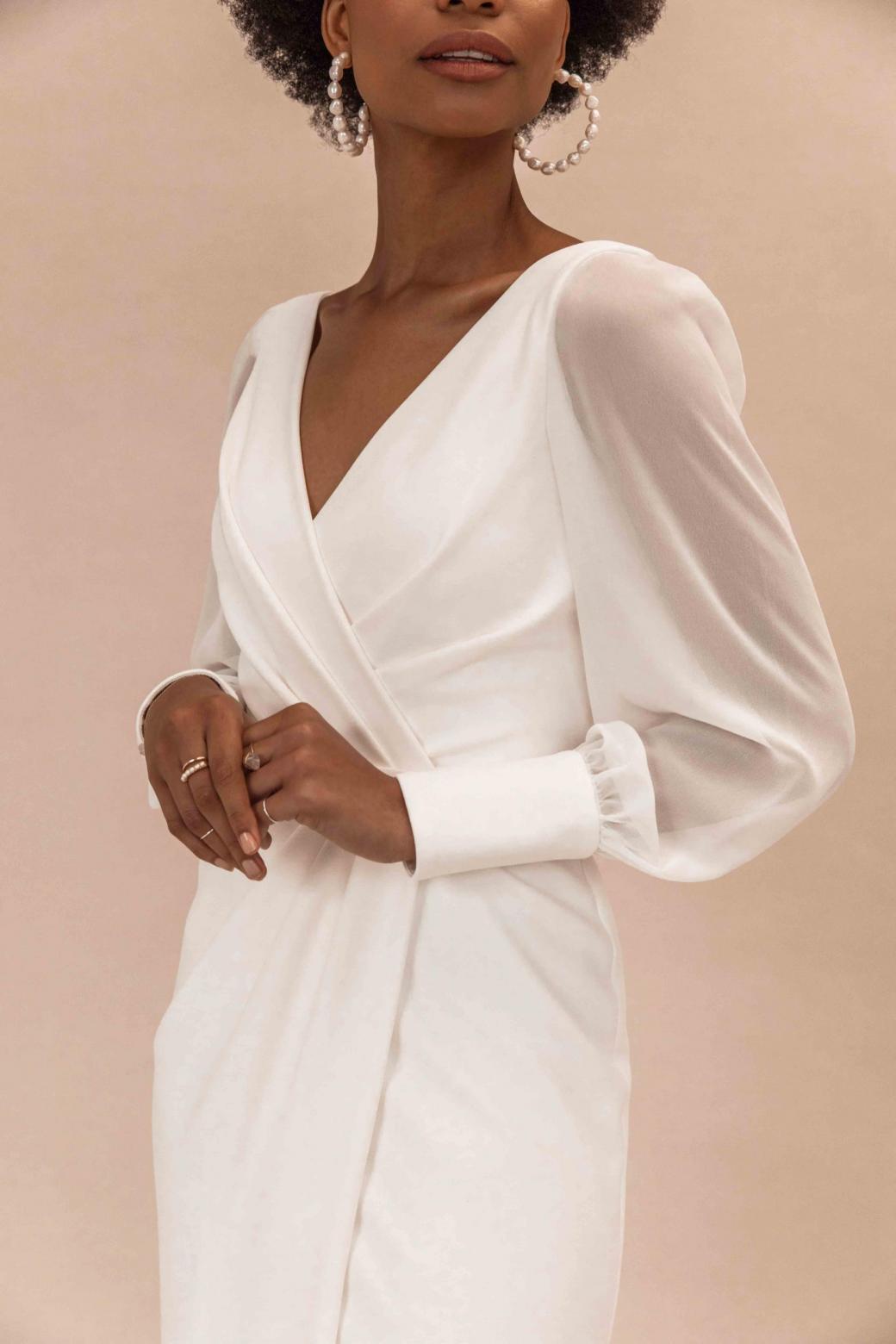 The Nikki gown by Karen Willis Holmes, simple wrap wedding dress with long sleeves.