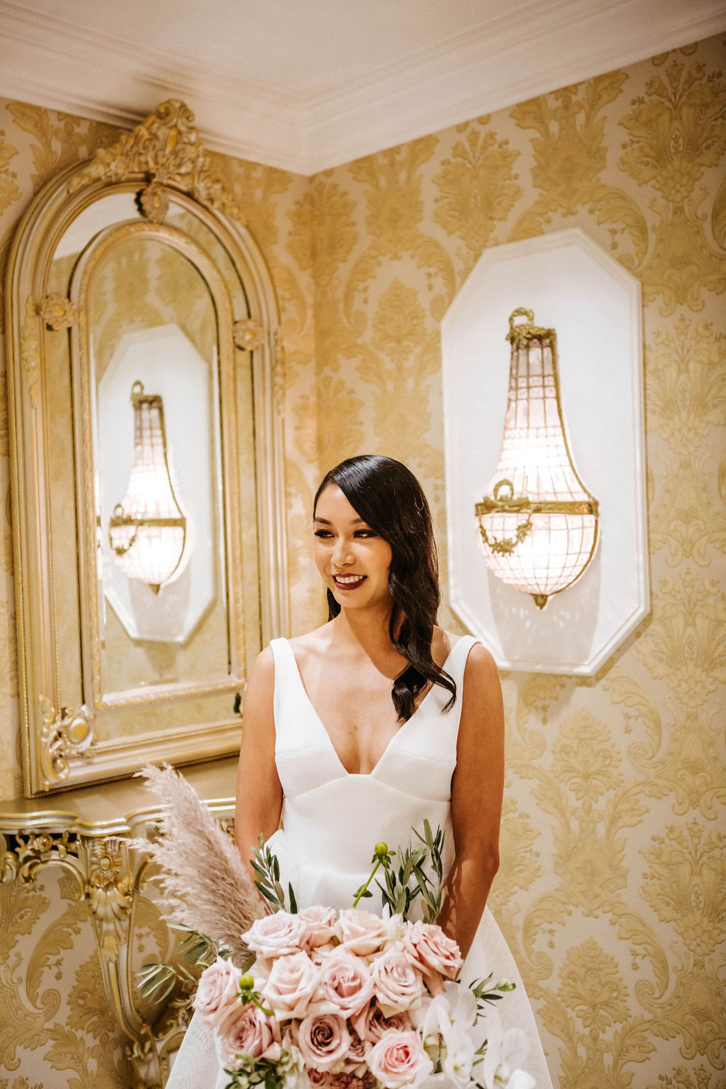 KWH bride Win wears the Bespoke wedding dress, Aisha, with pink roses for bridal bouquet.