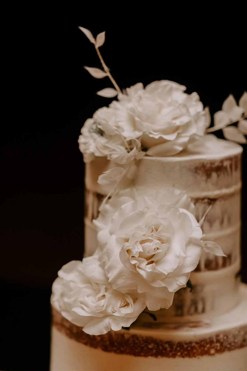 KWH bride Jemma's wedding cake with white florals details