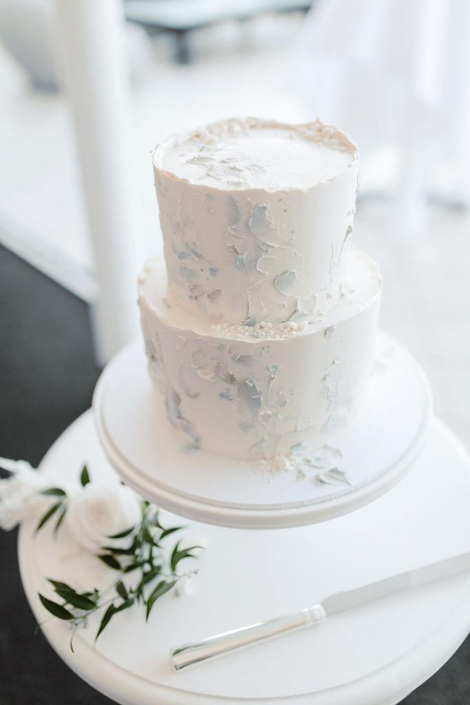 KWH bride Celeste's white wedding cake with metallic touches.