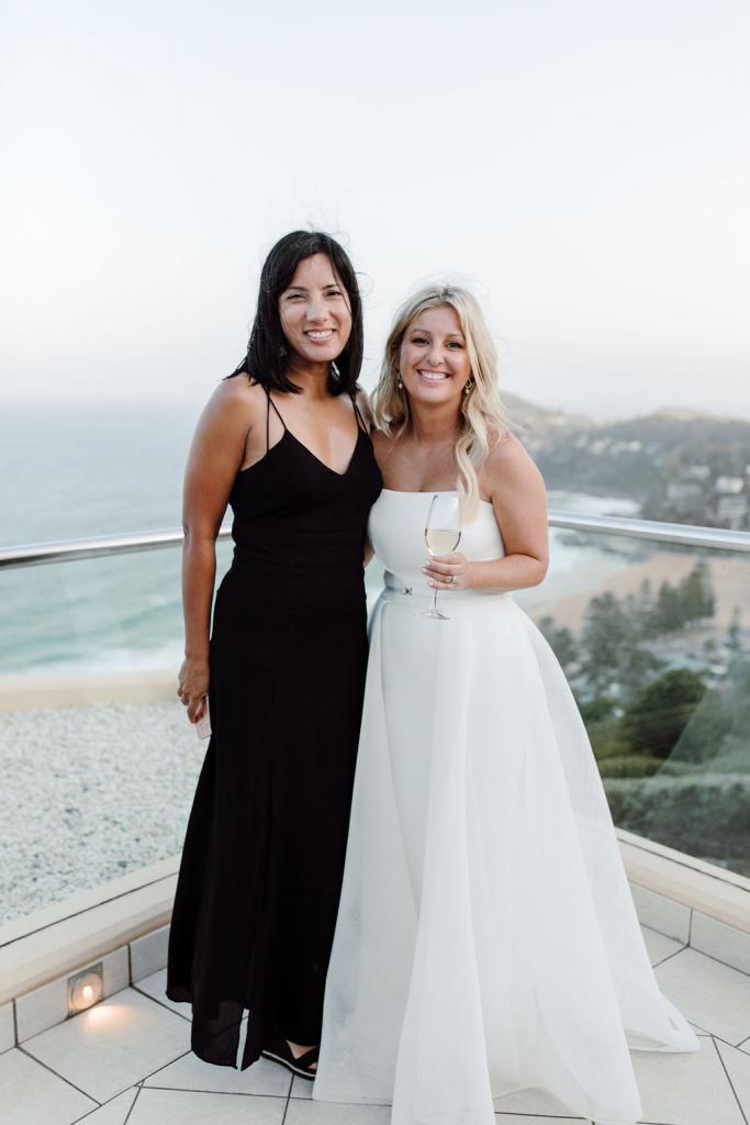KWH bride Celeste with wedding guest, wearing the strapless ESTHER wedding dress by Karen Willis Holmes.