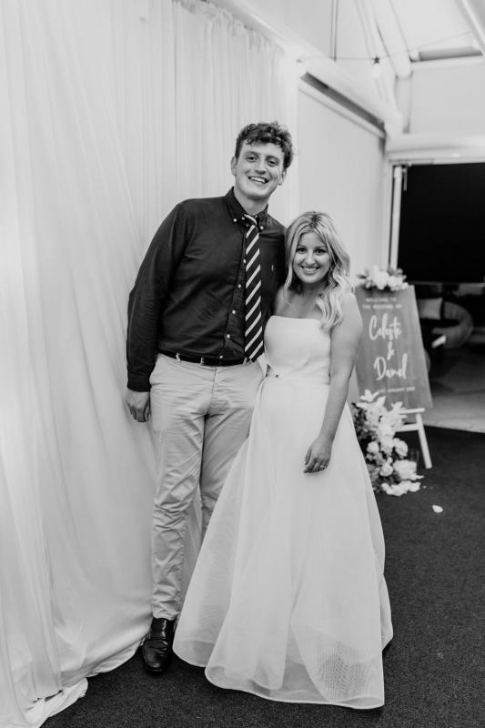 KWH bride Celeste with wedding guest, wearing the strapless ESTHER wedding dress by Karen Willis Holmes.