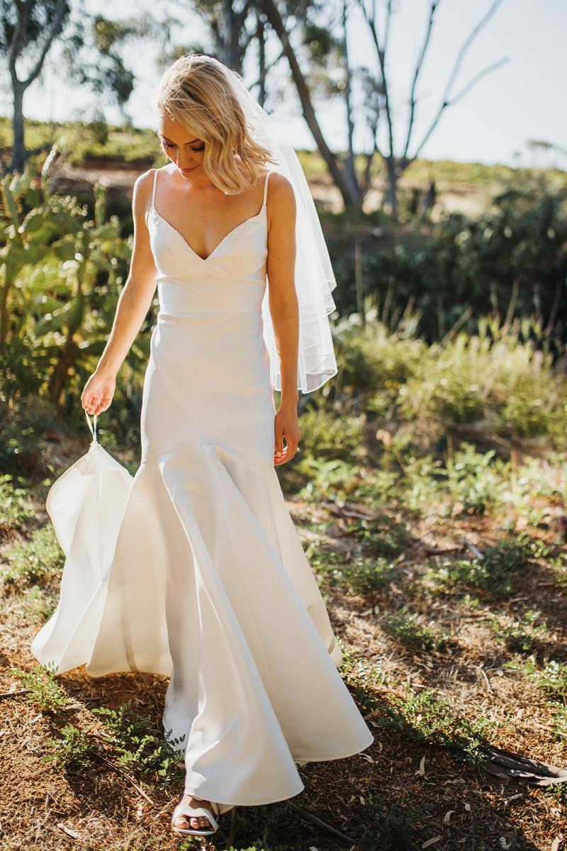 Brie wears Bespoke Jessie Catriona; a simple, dramatic wedding dress by Karen Willis Holmes