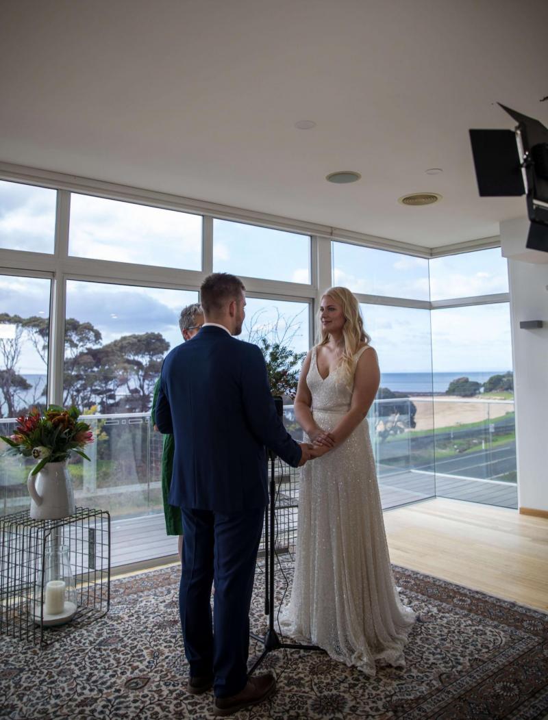 Bride and groom at the ceremony of their COVID-19d wedding