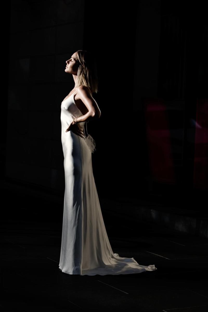 The Sage gown by Karen Willis Holmes, simple wedding dress with low back and feather detail