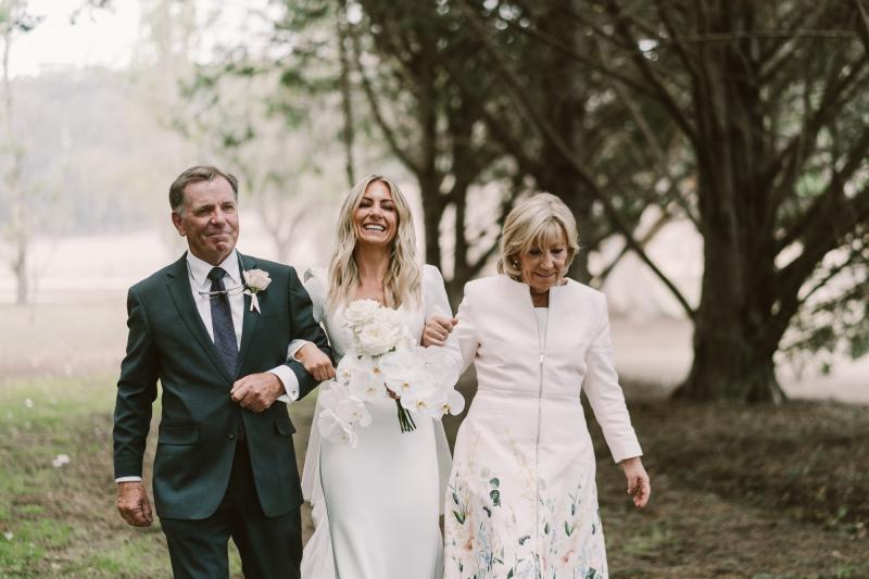Real bride Annabelle wears the Aubrey gown; a simple long-sleeved wedding dress from the Wild Hearts Collection, designed by Karen Willis Holmes.