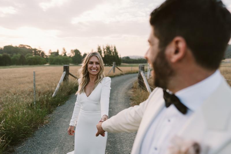 KWH bride Annabelle wearing the timeless Aubrey gown; a simple long sleeve wedding dress with a dramatic train.