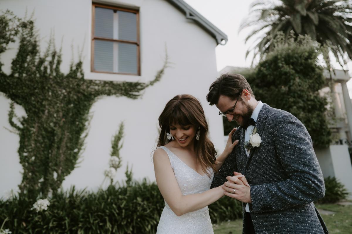 Bride Ania in Karen Willis Holmes Lola Wedding dress portrait with groom