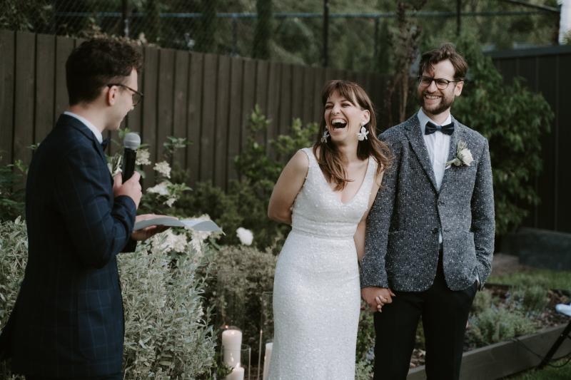 Bride Ania in Karen Willis Holmes Lola Wedding dress at wedding ceremony with husband