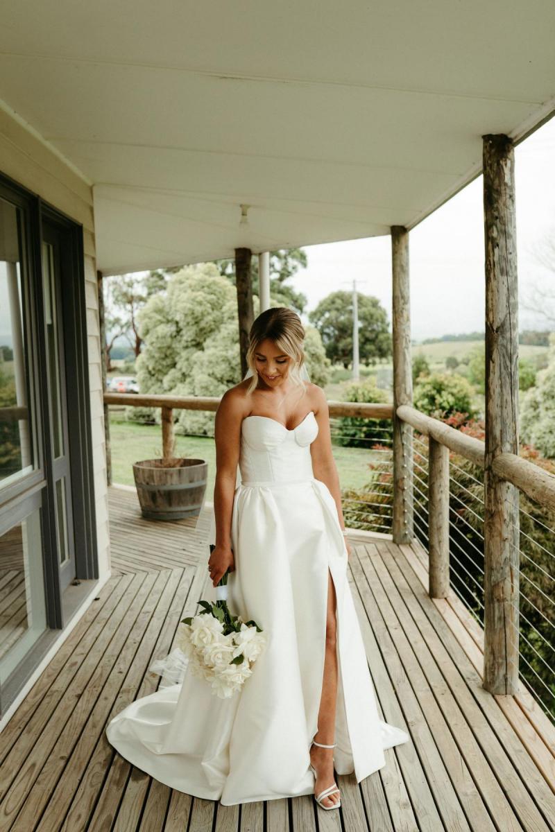 Real bride Brennah wears the Bespoke Blake Camille wedding dress; featuring a sweetheart neckline and traditional skirt by Karen Willis Holmes.