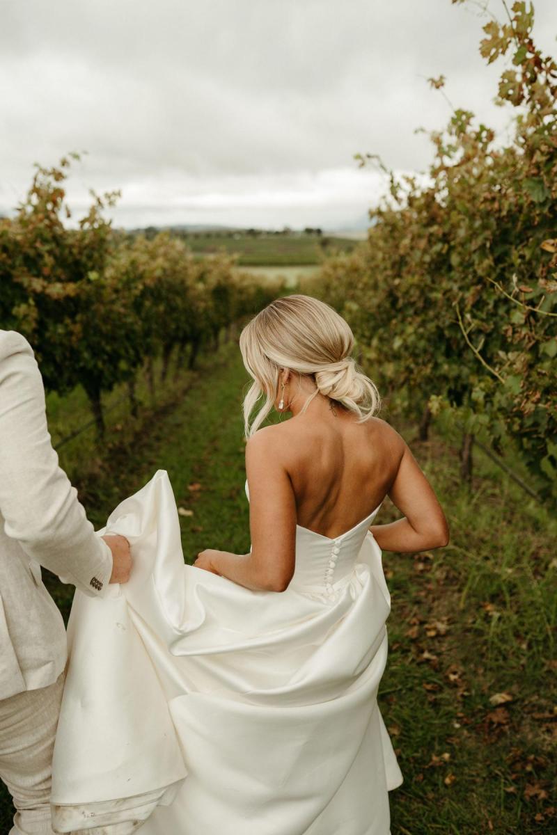 Real bride Brennah wears the Bespoke Blake Camille wedding dress; featuring a sweetheart neckline and traditional skirt by Karen Willis Holmes.