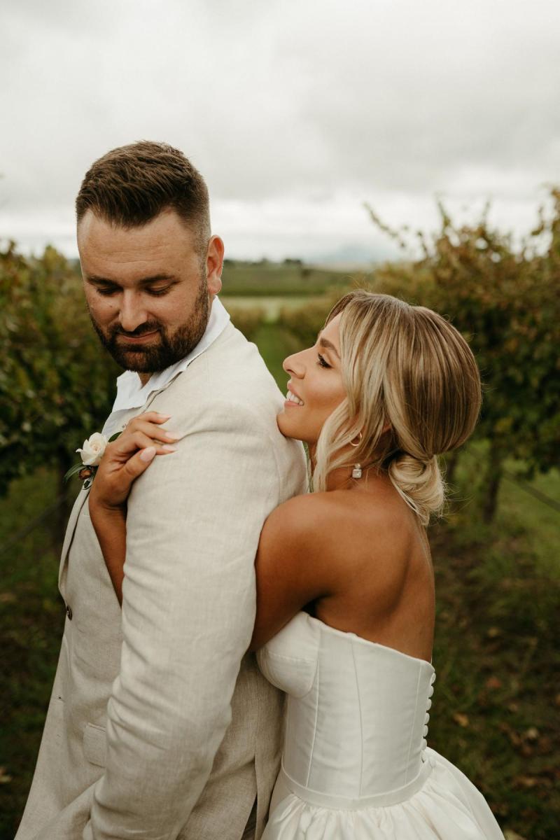 Real bride Brennah wears the Bespoke Blake Camille wedding dress; featuring a sweetheart neckline and traditional skirt by Karen Willis Holmes.