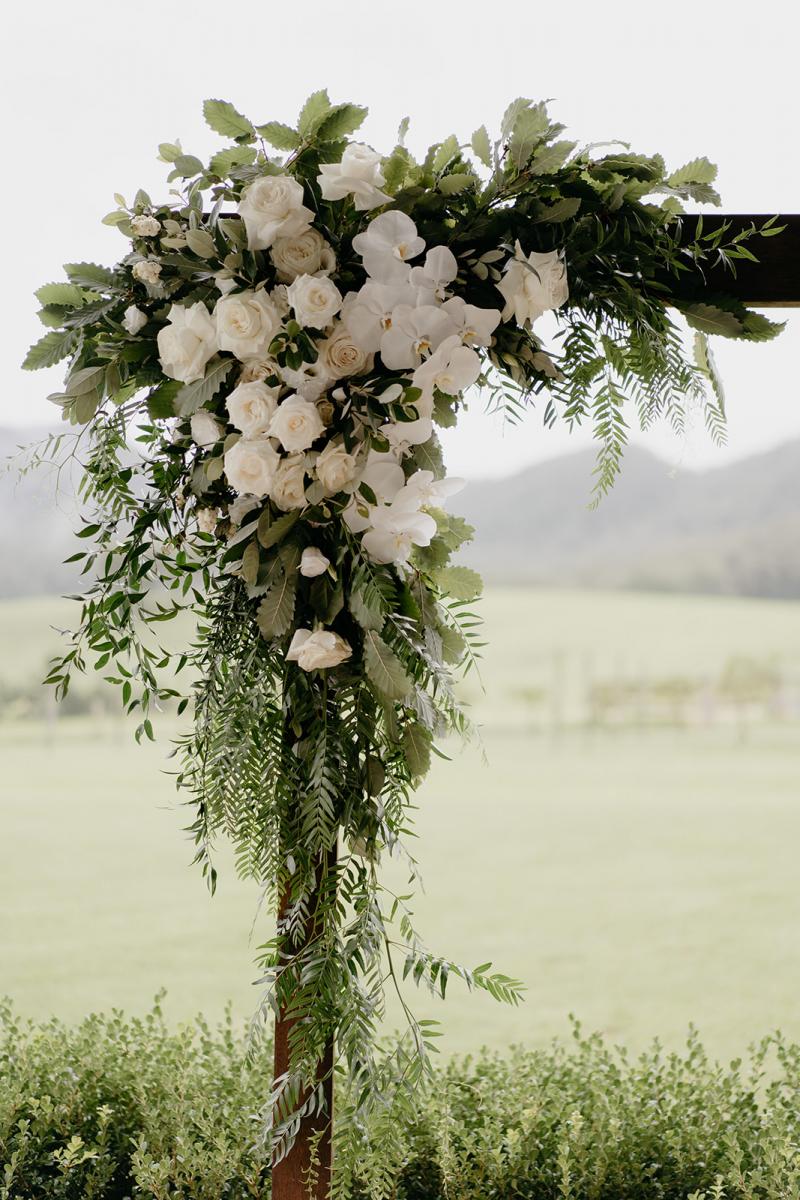 KWH bride Anna holding timeless bouquet wearing the art deco inspired Cassie wedding dress