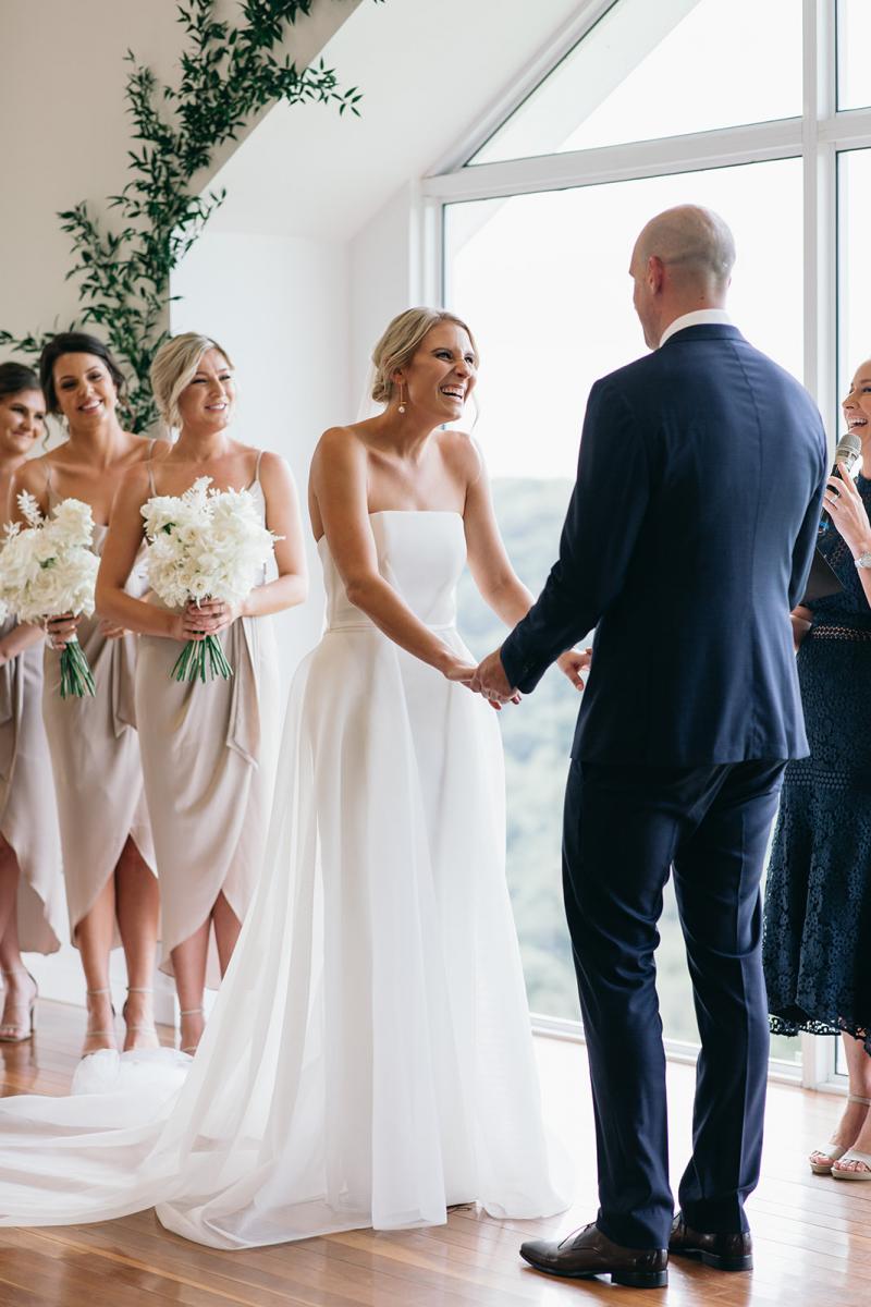 KWH bride Samantha and husband Adam at their ceremony; Samantha wears the strapless Esther wedding dress with long train.