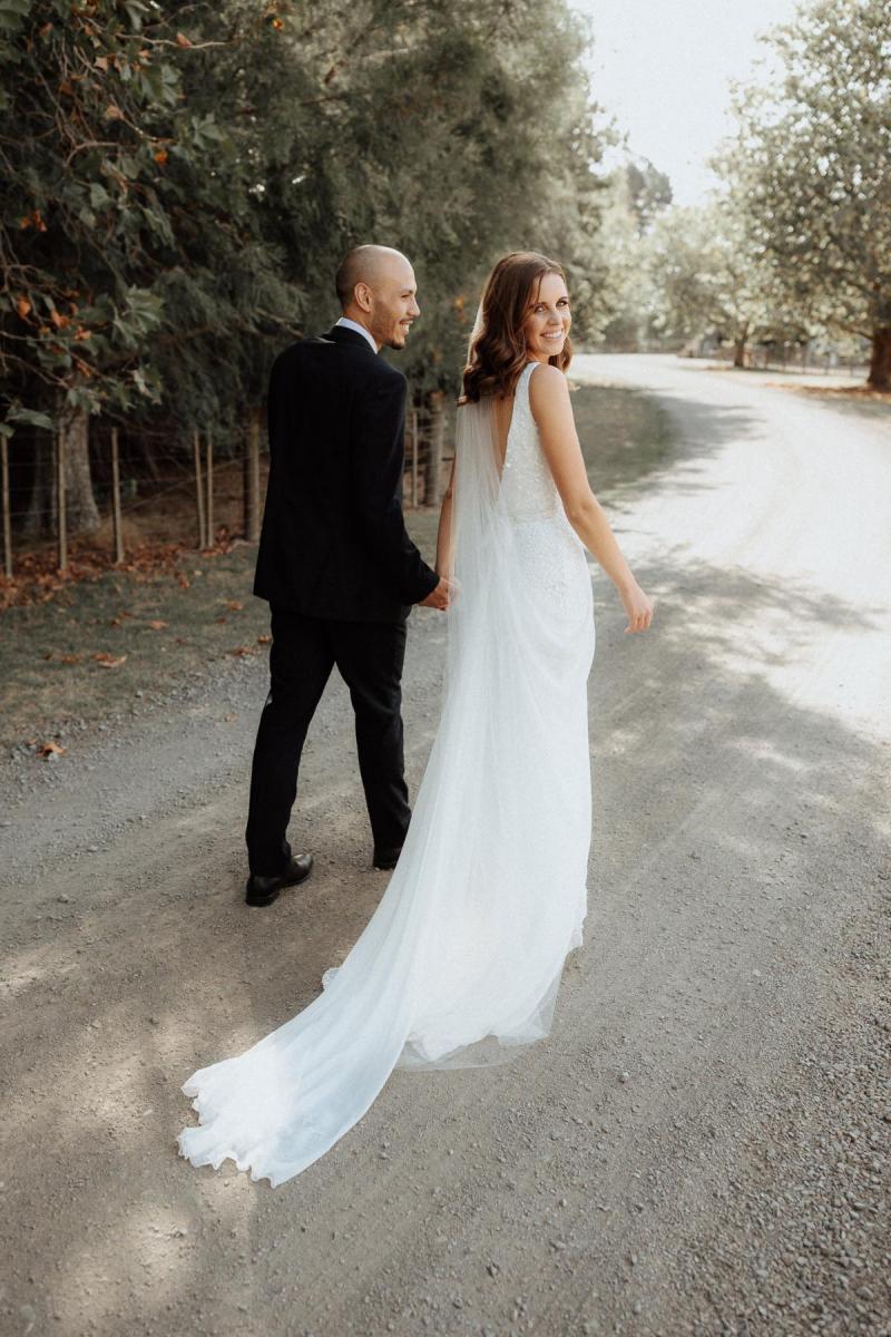 KWH bride Tash with husband Josh; wearing the Lola wedding dress and Genevieve trains