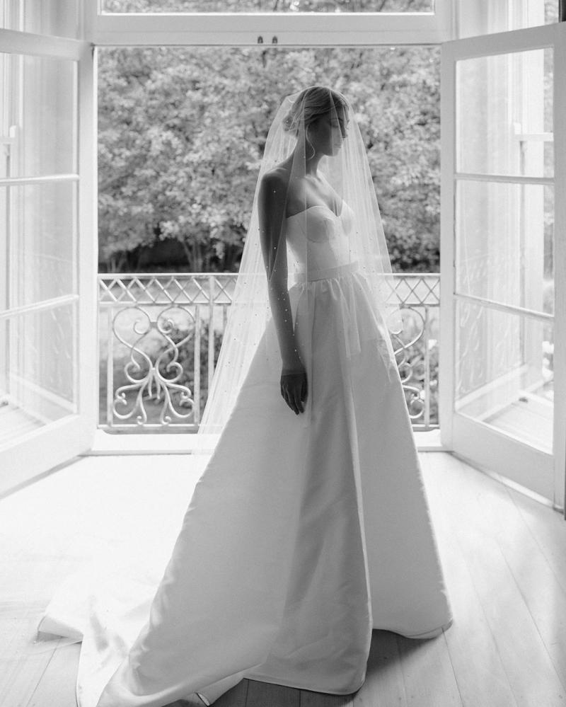 Model wears Blake Camille ball gown wedding dress style silhouette in twill by Karen Willis Holmes