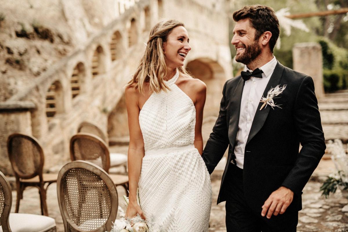 Model wears Chloe halterneck neckline wedding dress style in Giupure lace by Karen Willis Holmes