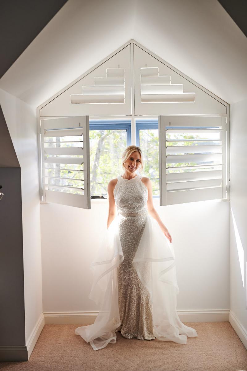 Real bride Claire getting ready for her Balmoral Beach wedding, wearing the Cindy gown, a beaded halterneck wedding dress by Karen Willis Holmes.