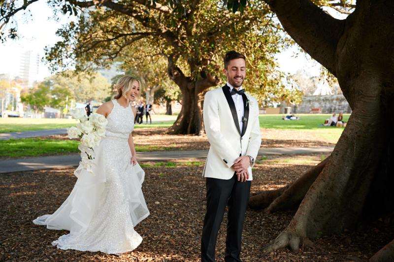 Real bride Claire wears the Cindy gown, a beaded halterneck wedding dress to her first look, Luxe dress by Karen Willis Holmes.