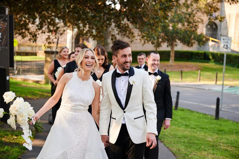 Real bride Claire wears the Cindy gown, a beaded halterneck wedding dress to her first look, Luxe dress by Karen Willis Holmes.