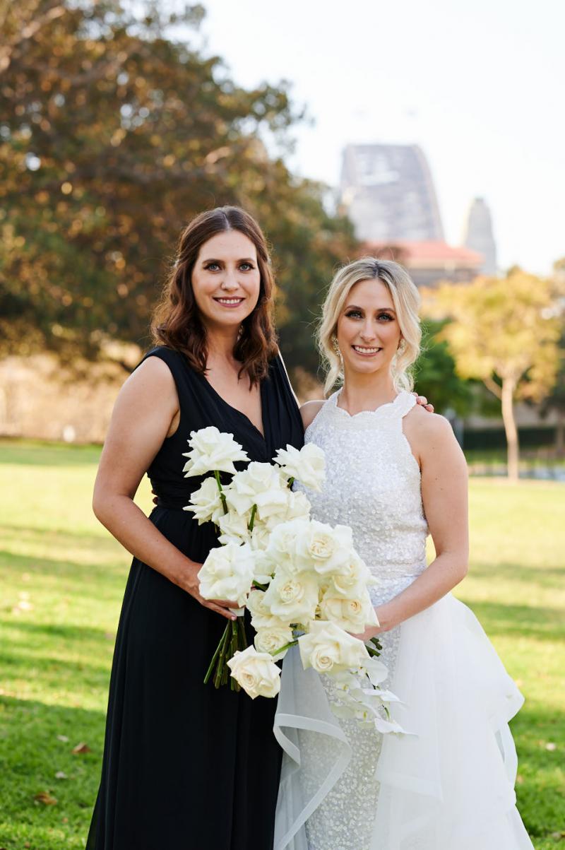 Real bride Claire wears the Cindy gown, a beaded halterneck wedding dress by Karen Willis Holmes to her Sydney wedding.