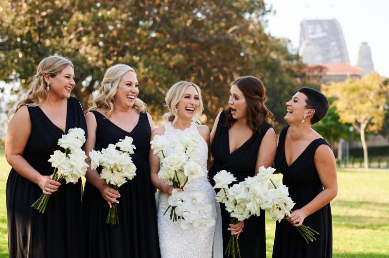 Real bride Claire wears the Cindy gown, a beaded halterneck wedding dress by Karen Willis Holmes to her Sydney wedding.