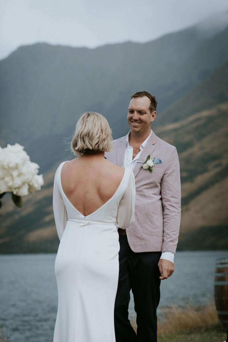 KWH bride Lauren and husband Will at their ceremony. Samantha wears the low back Nikki wedding dress with sleeves.