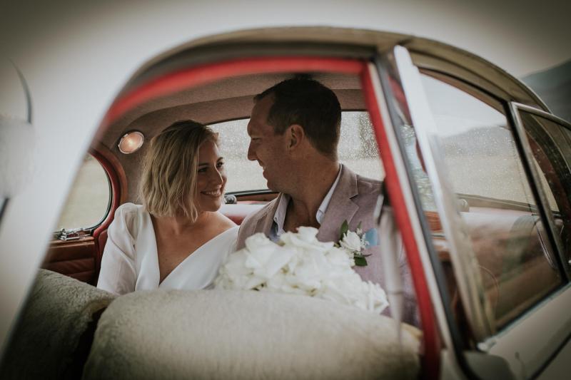 KWH bride Lauren and husband Will at their ceremony. Samantha wears the low back Nikki wedding dress with sleeves.