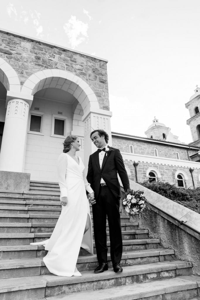 Real bride Shannon and her hubby on their wedding day, bride wears the long sleeved Nikki gown by Karen Willis Holmes.