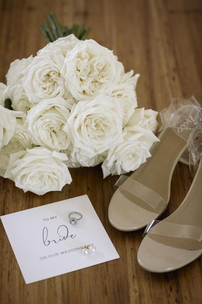Real bride accessories for KWH bride Lucy; featuring a white rose bouquet and clear PVC wedding heels.