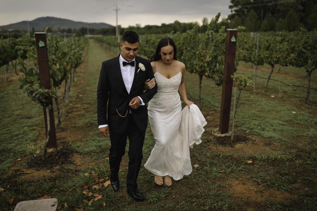 Real bride Lucy with husband Jarred; wearing the Addison gown; an art deco spaghetti strap wedding dress from the Luxe Collection by Karen Willis Holmes.